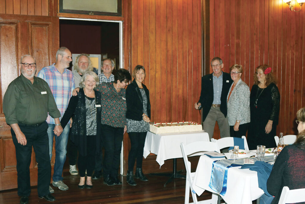 Charter Members cutting the 10th Anniversary Cake