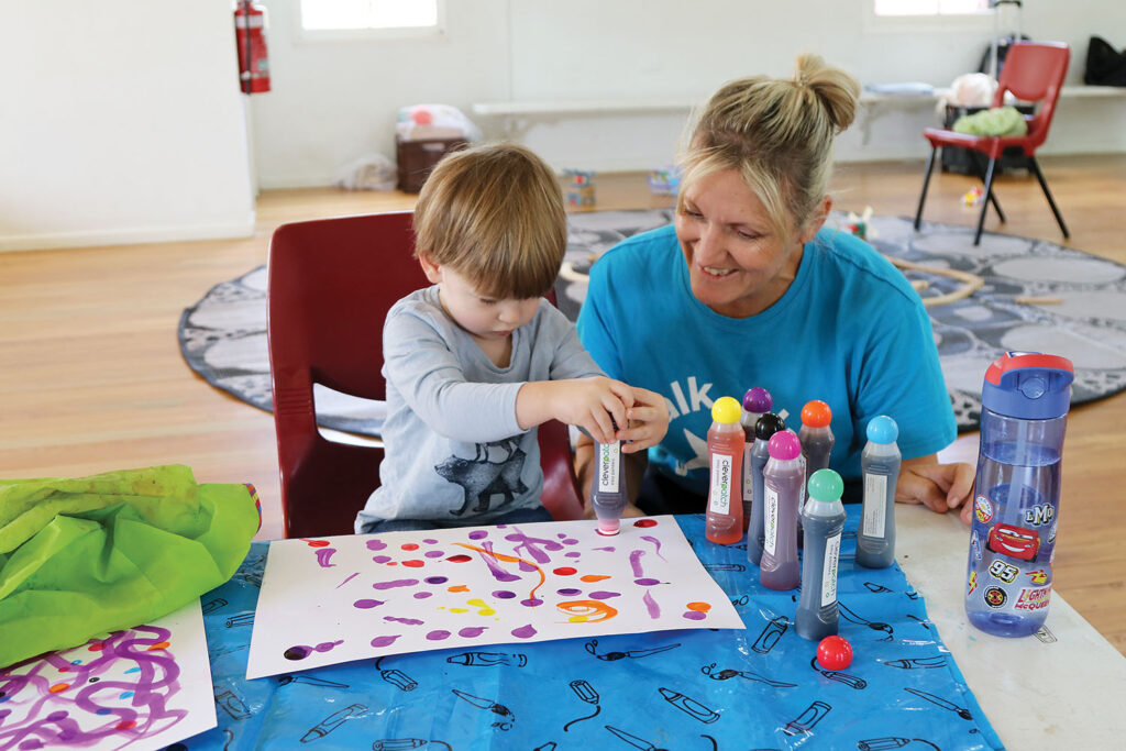 Gabriel enjoys dot painting with Heidi from First Five Forever