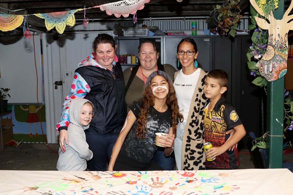 Aunties Nic, Kellie, and Robyn with members of their families 