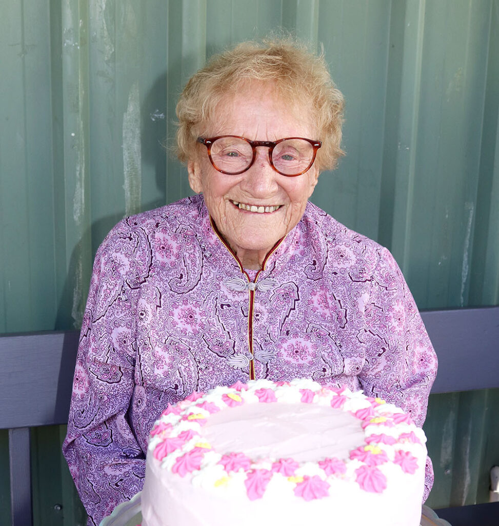 Elma and her very large pink Birthday Cake