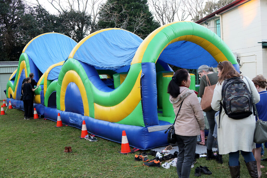 Families enjoying one of the inflatable structures of fun!