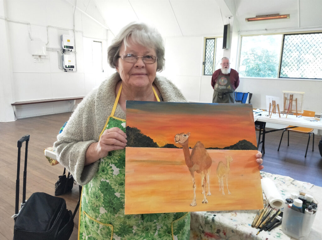 Jan Skelton with her artwork piece of a Camel