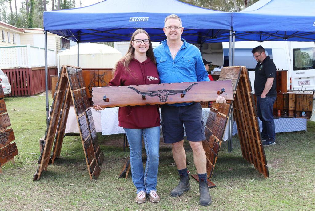 Cr Jeff McConnell with daughter Casey-Ann picking up a Dad’s Day gift from Colin’s Wood Stand