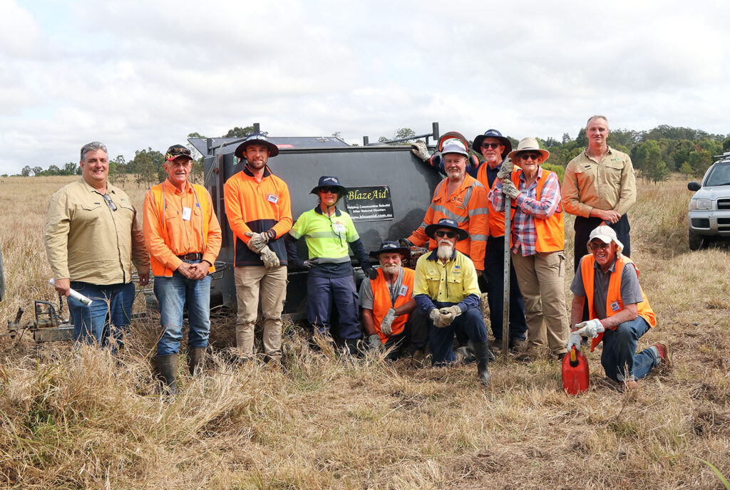 Shane Platell (YET Woodstock Coordinator) and Ian Frame (Youth Enterprise Trust CEO) with BlazeAid Volunteers @ Woodstock, Tamborine: Gary Lawrence (Camp Co-ordinator), Callum, Trish, Ian, John, Nigel (Team Leader), James, Trish, & Graeme