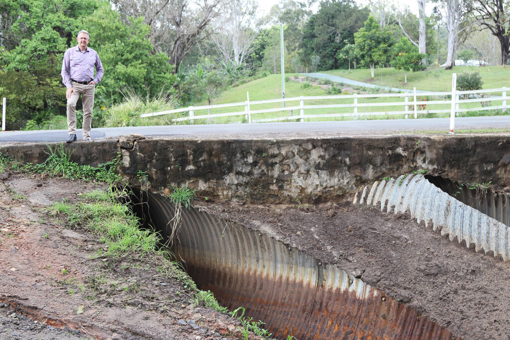 Councillor Jeff McConnell inspecting road repairs in Division 2