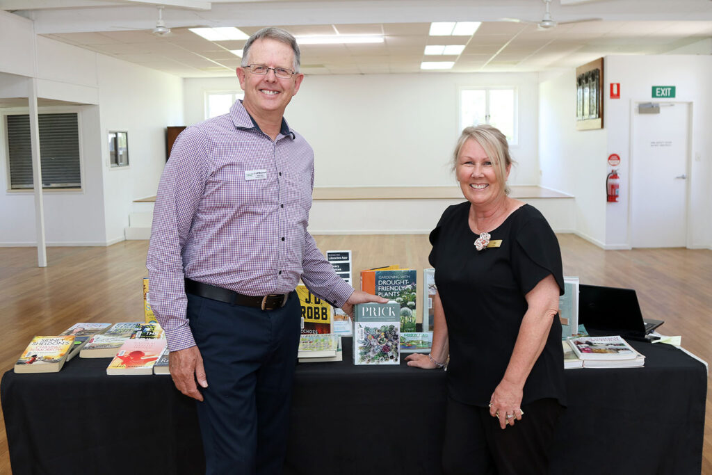 Division 2 Cr Jeff McConnell (Deputy Mayor) with Jan Harradine (Outreach Library Service) and book display