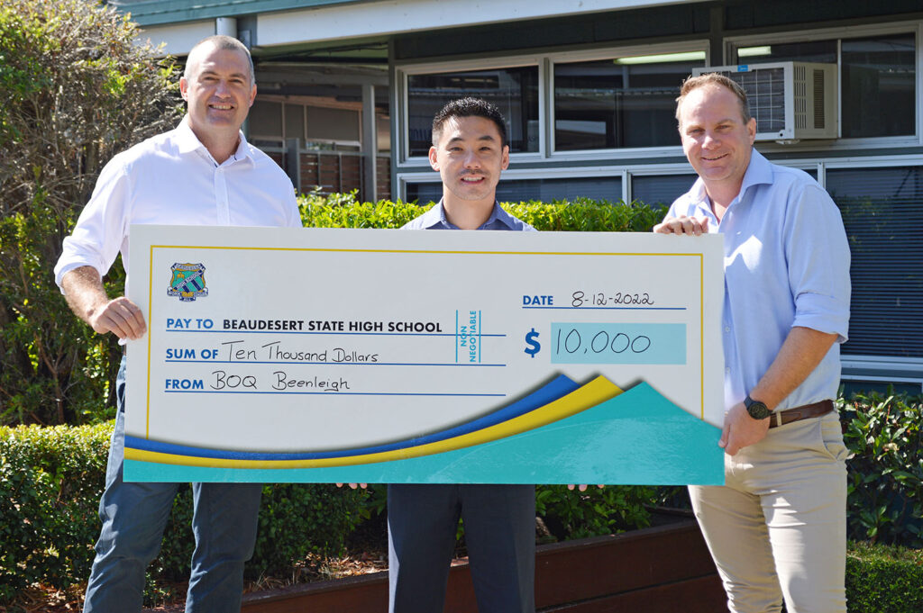 Mr Brian Managbanag, Owner Manager of BOQ Beenleigh, presenting a $10,000 cheque of sponsorship to Beaudesert State High School Principal Mr Grant Stephensen (L) and BSHS Business Manager Mr Ben Pollard (R)