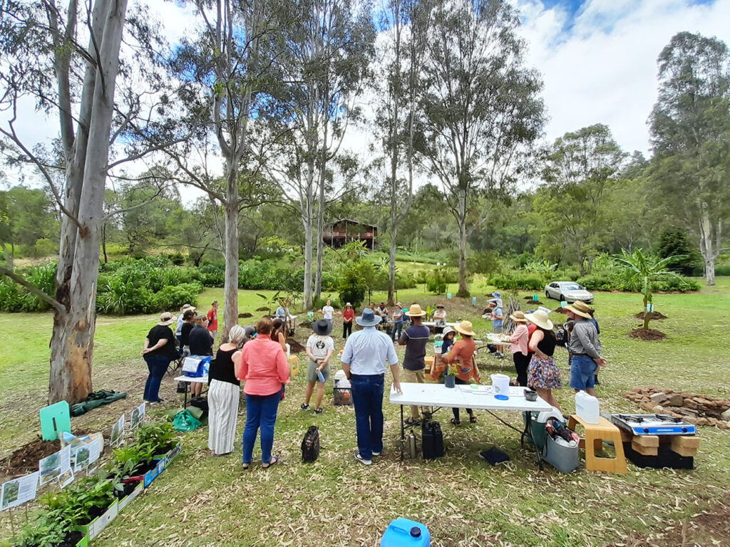 Hosts talking about the Tamborine Village Homestead property