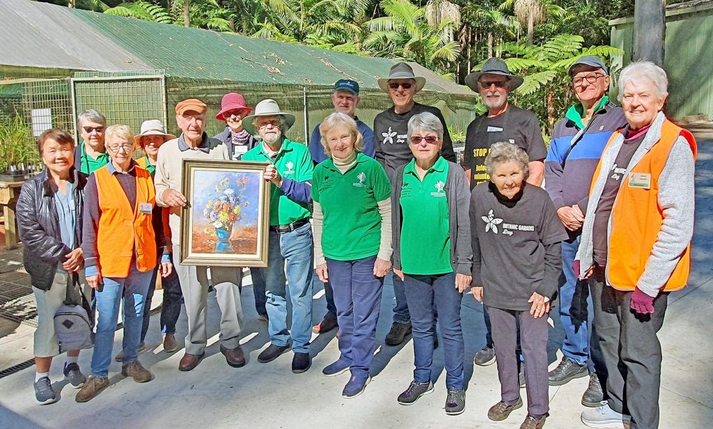 Volunteers of the Tamborine Mountain Regional Botanic Gardens team  with art donor Alfred Briers